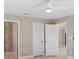 Bedroom with access to multiple rooms and ceiling fan at 509 Sunset N Rd, Rotonda West, FL 33947