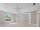 Bright bedroom with wood-look floors and ceiling fan at 509 Sunset N Rd, Rotonda West, FL 33947