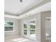 Light-filled dining room with French doors leading to the backyard at 509 Sunset N Rd, Rotonda West, FL 33947