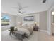 Main bedroom with large window and wood-like flooring at 509 Sunset N Rd, Rotonda West, FL 33947