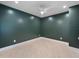 Spacious spare bedroom with dark green walls and hardwood floors at 509 Sunset N Rd, Rotonda West, FL 33947