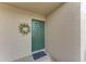 Green front door with a spring floral wreath at 601 Shreve St # 46A, Punta Gorda, FL 33950