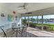 Bright lanai with water views and seating for four at 601 Shreve St # 46A, Punta Gorda, FL 33950