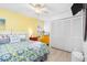 Bedroom with yellow accent wall and king-size bed at 604 Foxwood Blvd, Englewood, FL 34223