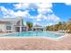 Inviting community pool area with surrounding patio and lounge chairs at 604 Foxwood Blvd, Englewood, FL 34223