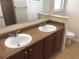 Bathroom with double sinks and granite countertops at 6379 Grand Cypress Blvd, North Port, FL 34287