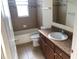 Clean bathroom with tub, shower, and vanity at 6379 Grand Cypress Blvd, North Port, FL 34287