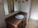 Bathroom vanity with granite countertop and sink at 6379 Grand Cypress Blvd, North Port, FL 34287