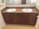 Double vanity with granite countertop at 6379 Grand Cypress Blvd, North Port, FL 34287