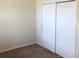 Spacious bedroom with neutral walls and double door closet at 6379 Grand Cypress Blvd, North Port, FL 34287