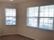 Bedroom with large window and neutral walls at 6379 Grand Cypress Blvd, North Port, FL 34287