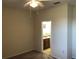 Bedroom with ceiling fan and bathroom access at 6379 Grand Cypress Blvd, North Port, FL 34287