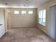 Spacious dining room with neutral carpeting and large windows at 6379 Grand Cypress Blvd, North Port, FL 34287