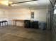 Garage with workbench and trash cans at 6379 Grand Cypress Blvd, North Port, FL 34287