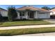 Single-story home with attached garage and well-maintained lawn at 6379 Grand Cypress Blvd, North Port, FL 34287