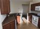 Kitchen features wood cabinets, granite countertops, and a dishwasher at 6379 Grand Cypress Blvd, North Port, FL 34287