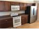 Kitchen with stainless steel refrigerator and white cabinetry at 6379 Grand Cypress Blvd, North Port, FL 34287