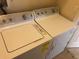 Washer and dryer in a well-lit laundry room at 6379 Grand Cypress Blvd, North Port, FL 34287