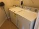 Laundry room with washer, dryer, and utility sink at 6379 Grand Cypress Blvd, North Port, FL 34287