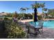 Resort-style pool with surrounding patio furniture at 6379 Grand Cypress Blvd, North Port, FL 34287