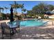 Inviting community swimming pool with lounge chairs at 6379 Grand Cypress Blvd, North Port, FL 34287