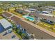 Aerial view of community with pool and parking at 6796 Gasparilla Pines Blvd # 77, Englewood, FL 34224