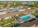 Community pool and surrounding buildings at 6796 Gasparilla Pines Blvd # 77, Englewood, FL 34224