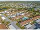 Aerial view of community with pool and parking at 6796 Gasparilla Pines Blvd # 77, Englewood, FL 34224