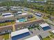 Aerial view of community complex, pool, and landscaping at 6796 Gasparilla Pines Blvd # 77, Englewood, FL 34224