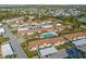 Aerial view of community with pool and parking at 6796 Gasparilla Pines Blvd # 77, Englewood, FL 34224