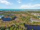 Wide view of waterfront property with lush landscape and waterways at 6796 Gasparilla Pines Blvd # 77, Englewood, FL 34224