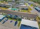 Community view showing building arrangement, parking, and a community pool at 6796 Gasparilla Pines Blvd # 77, Englewood, FL 34224