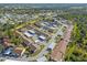 Aerial view of community with central pool area at 6796 Gasparilla Pines Blvd # 77, Englewood, FL 34224