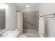 Clean bathroom with shower/tub combo, grab bar, and updated vanity at 6796 Gasparilla Pines Blvd # 77, Englewood, FL 34224