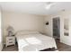 Main bedroom with king-size bed and en-suite bathroom access at 6796 Gasparilla Pines Blvd # 77, Englewood, FL 34224