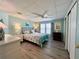 Bedroom with a queen-size bed, two nightstands, and a dresser at 739 Tangerine Woods Blvd, Englewood, FL 34223