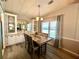 Bright dining room featuring a wooden table and built-in cabinetry at 739 Tangerine Woods Blvd, Englewood, FL 34223