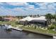 Aerial view of waterfront home with pool and boat dock at 920 Via Tripoli, Punta Gorda, FL 33950