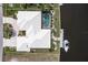 Bird's-eye view of house, pool, boat dock, and driveway at 920 Via Tripoli, Punta Gorda, FL 33950