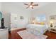 Bright bedroom with hardwood floors and a ceiling fan at 920 Via Tripoli, Punta Gorda, FL 33950