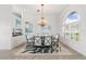 Spacious dining room featuring a chandelier and large windows at 920 Via Tripoli, Punta Gorda, FL 33950