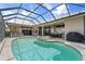 Resort-style pool and spa with screened enclosure at 920 Via Tripoli, Punta Gorda, FL 33950