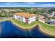 Aerial view of condo building showcasing lakefront location and community at 1000 San Lino Cir # 1011, Venice, FL 34292