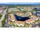 Wide aerial view showing condo location in community near a lake at 1000 San Lino Cir # 1011, Venice, FL 34292