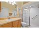 Neutral bathroom featuring walk-in shower, tile floors, and vanity at 1117 Topelis Dr, Englewood, FL 34223