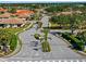 Street view in the Oak Forest community with well-manicured landscaping, sidewalks, and beautiful homes at 1117 Topelis Dr, Englewood, FL 34223