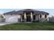 Modern house with gray roof and stone accents at 12 Ebb Cir, Placida, FL 33946