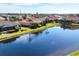 Aerial view of house and canal at 1207 Highland Greens Dr, Venice, FL 34285