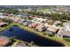 Aerial view of community with golf course at 1207 Highland Greens Dr, Venice, FL 34285