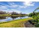 Scenic view of canal reflecting homes and sky at 1207 Highland Greens Dr, Venice, FL 34285